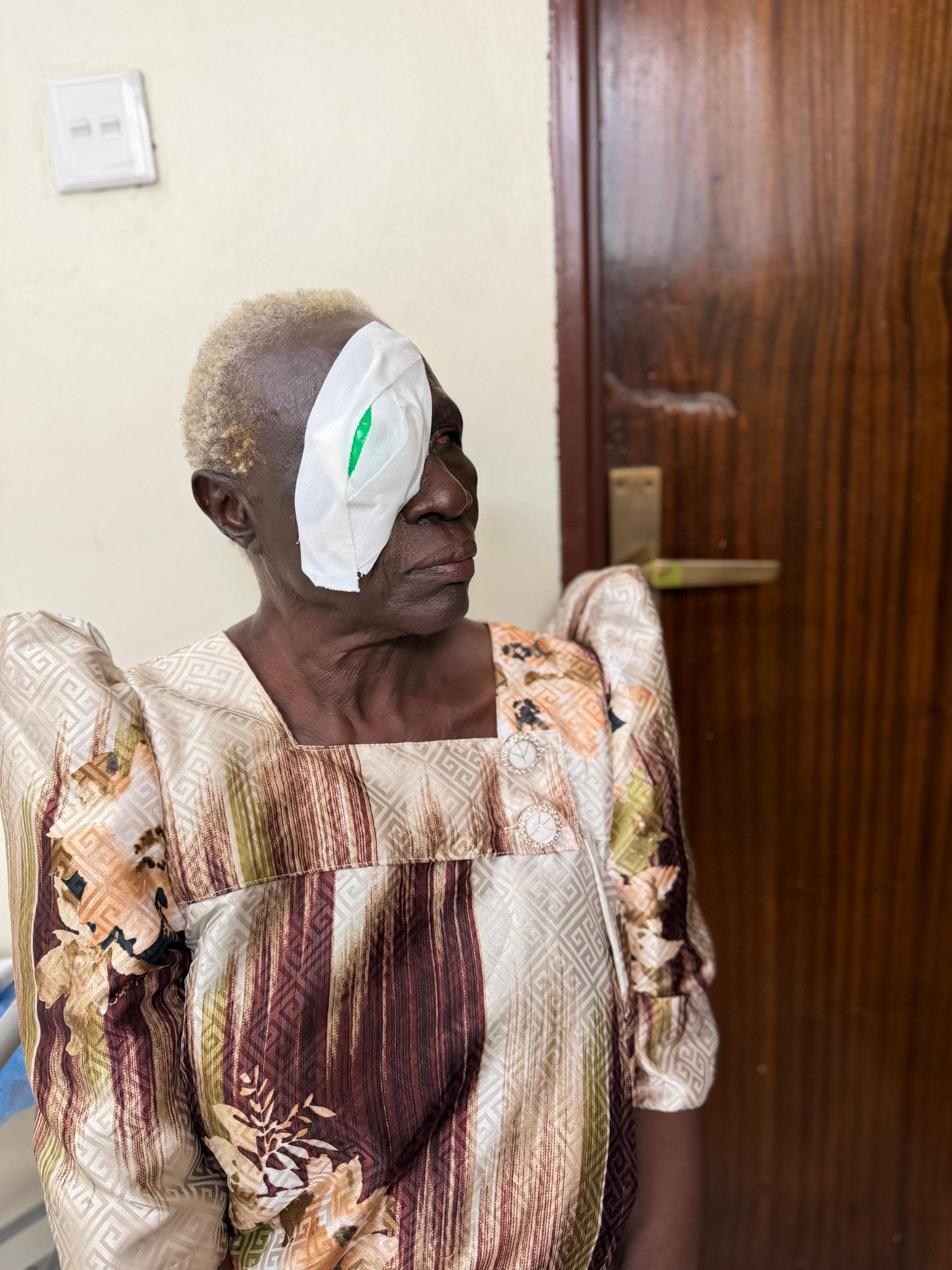 An elder receiving cataract care through a Musana medical outreach